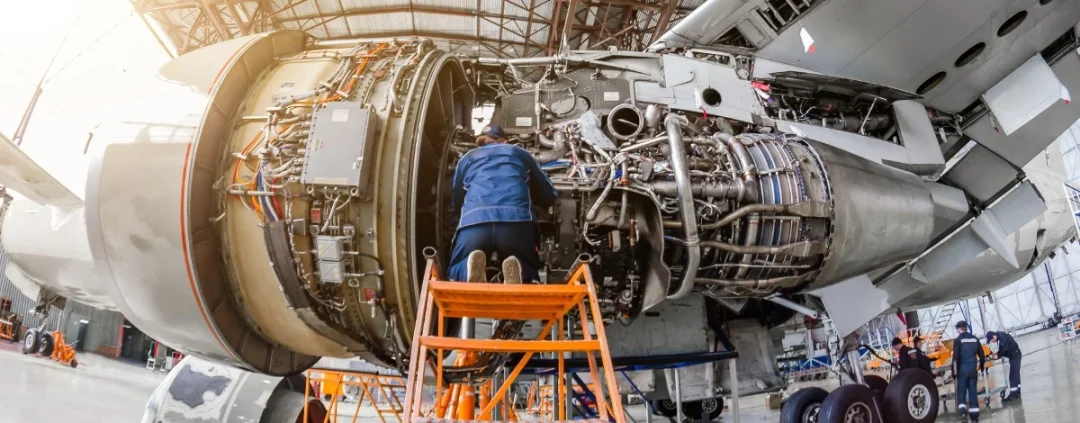 team member working on aircraft