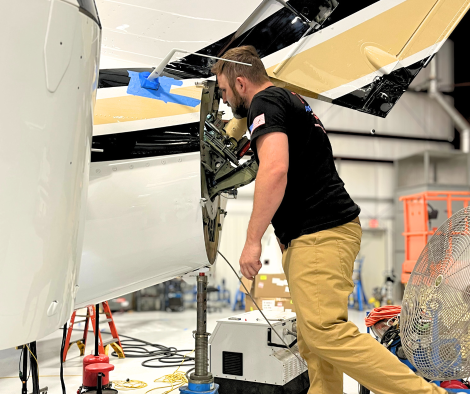 Sage-Popovich team working on an aircraft