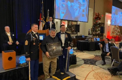 Nick Popovich accepting an award